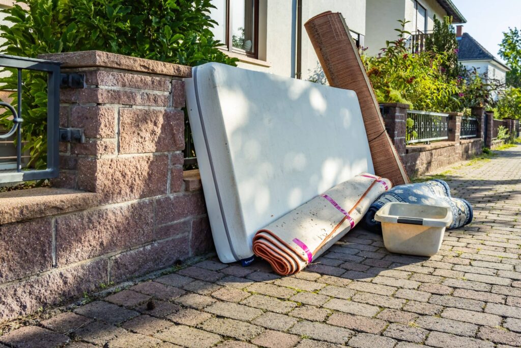 Large furniture sitting outside an apartment in need of bulk removal services